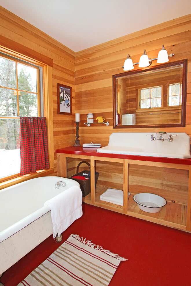 Rustic bathroom with red floor