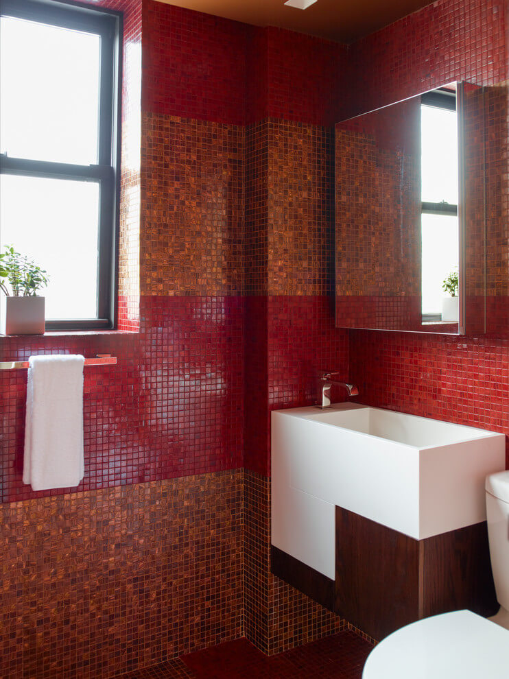 Amber and red tiled bathroom