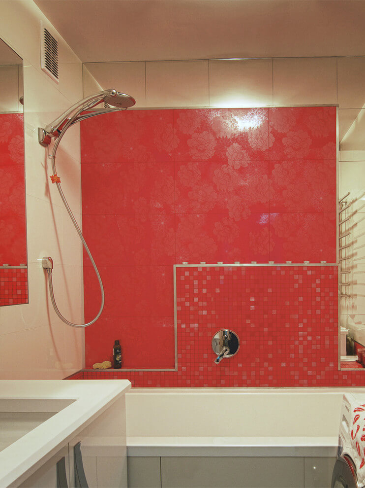Modern bathroom with red accent wall