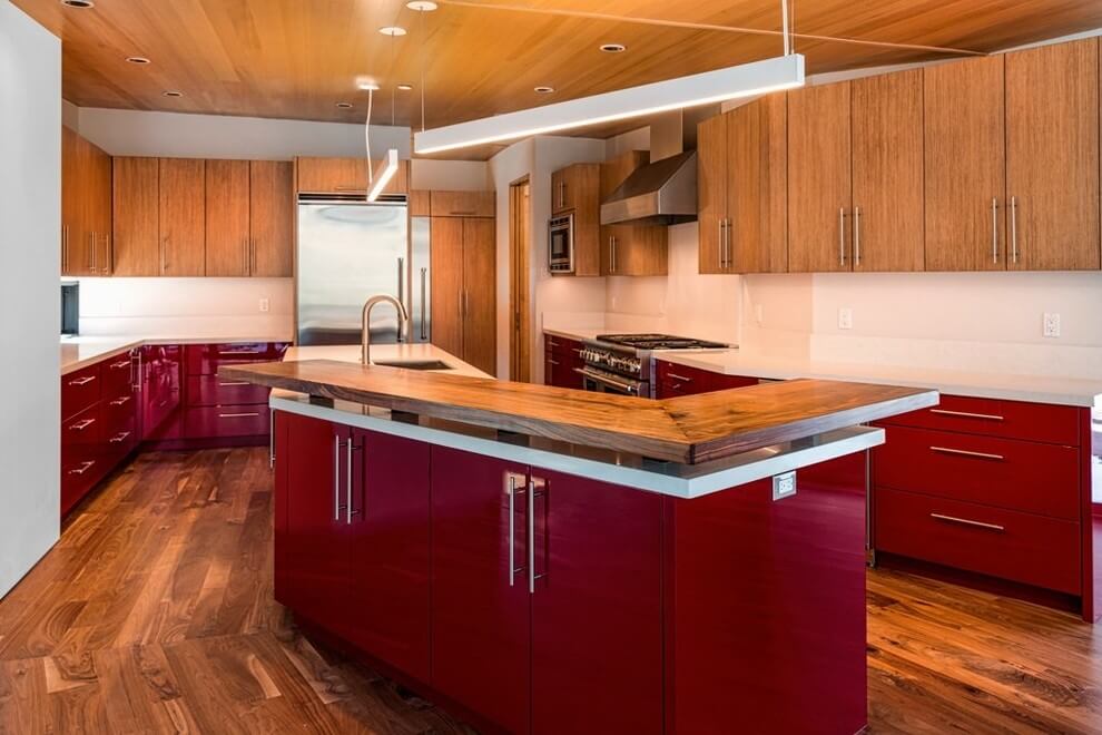 Expansive dark red and wooden kitchen