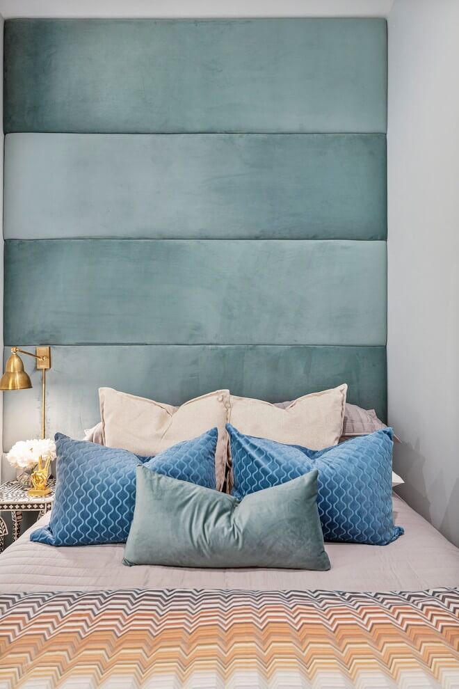 Simple bedroom with turquoise headboard