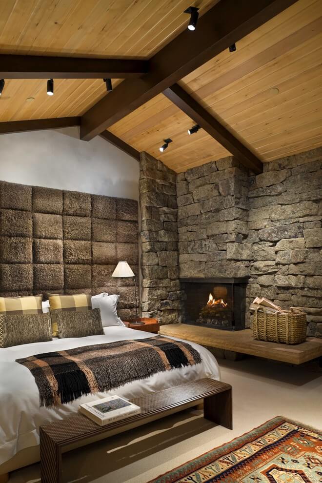 Rustic bedroom with fireplace in the corner