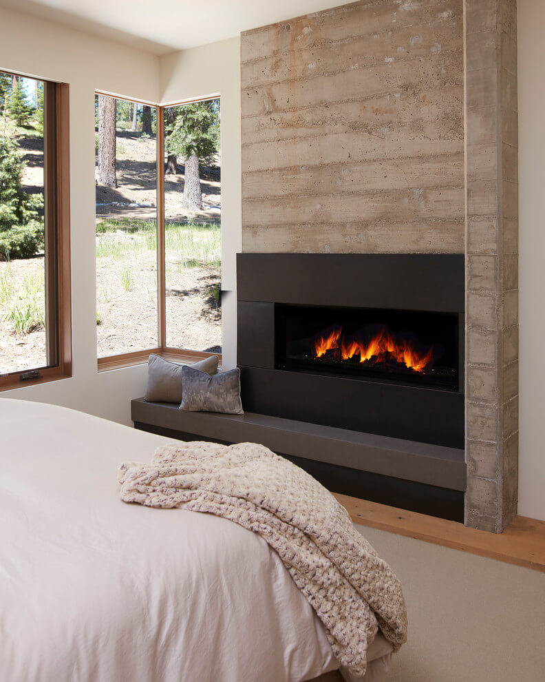 Built-in fireplace in modern bedroom