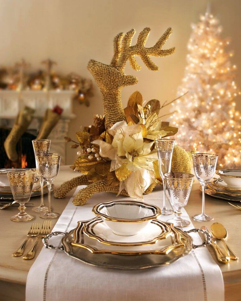 Glamorous setting of gold Christmas table