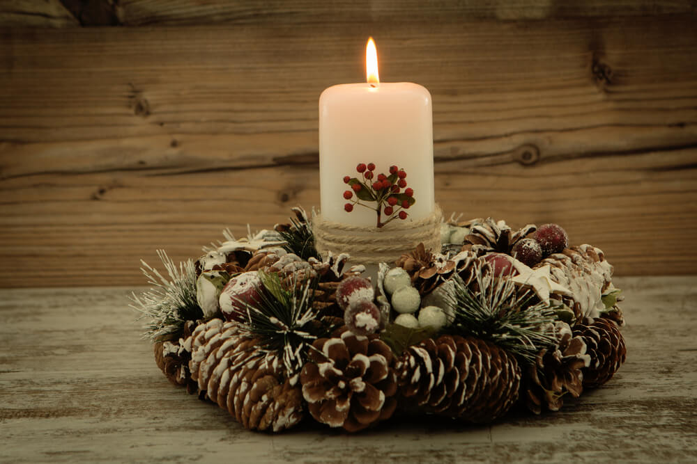 Rustic candles and pine cones center piece