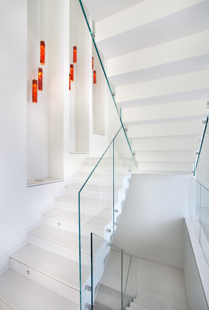 White staircase walls with hanging lights