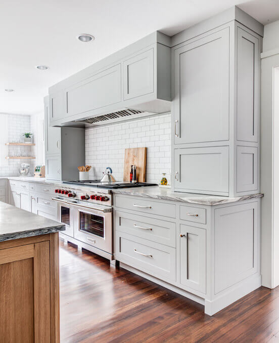 Gray kitchen cabinets with white wall plates