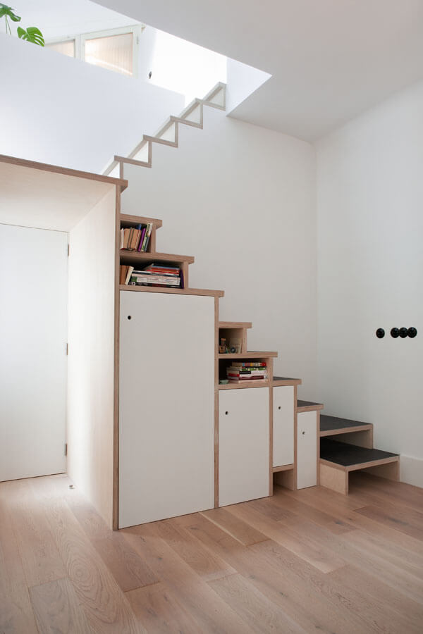 Space-saving plywood stair storage design