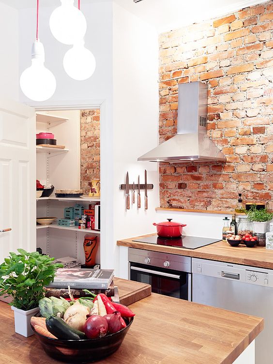 Exposed brick kitchen design with pantry