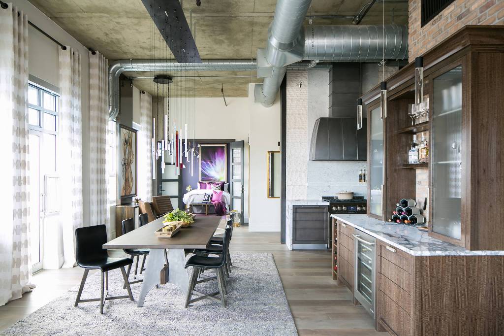 Industrial brick wall kitchen and dining area