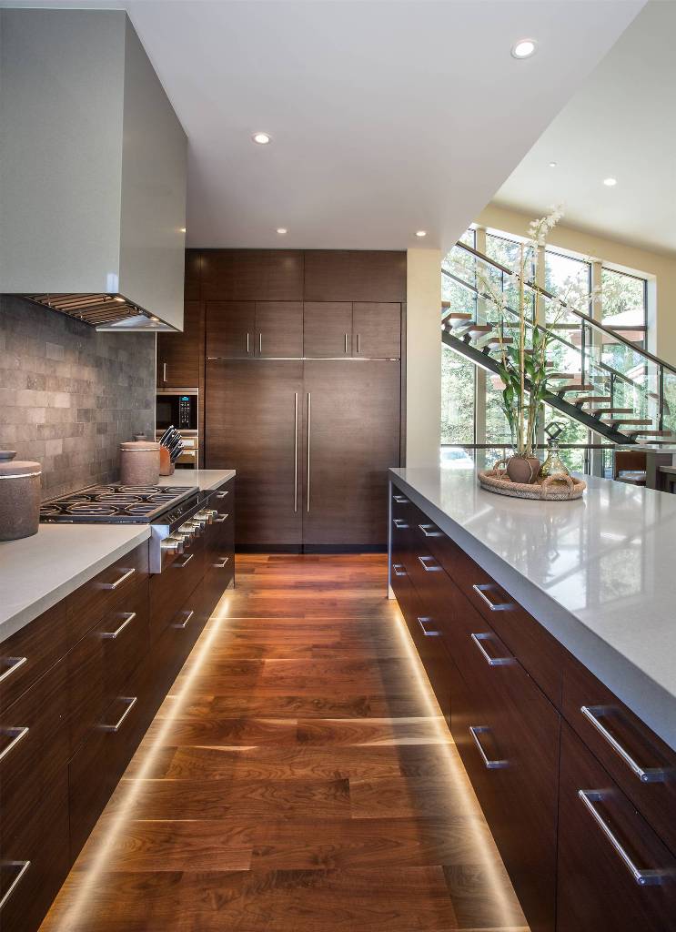 Modern kitchen with walnut cupboard and worktop in quartz