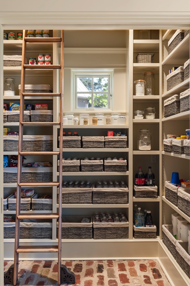 kitchen pantry with open cupboards and organizational baskets
