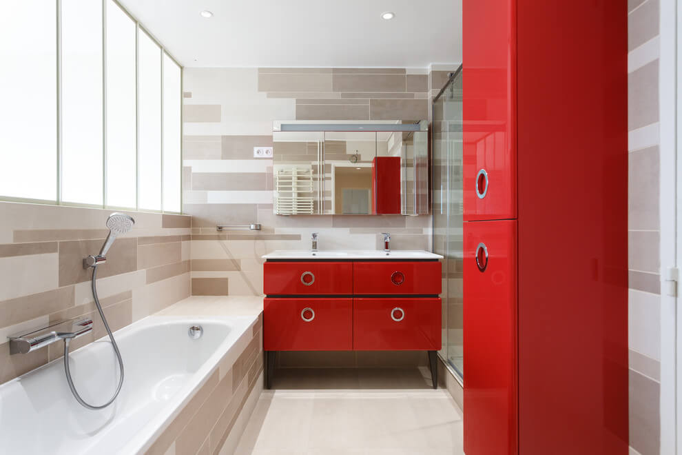 Fresh modern bathroom with red accents