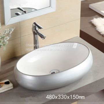 Bathroom ceramic new oval modern hand wash basin in factory price .