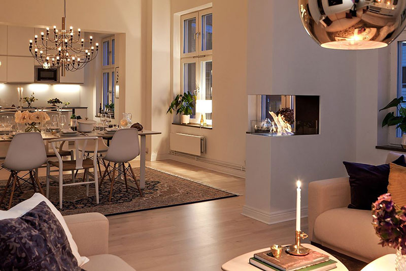 Scandinavian apartment with cozy atmosphere on evenings .