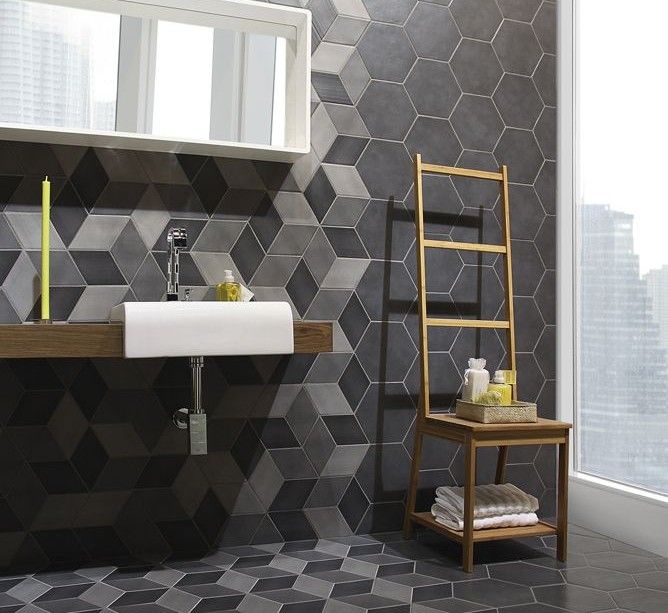 Contemporary geometric bathroom tiling - bit too much on floors .