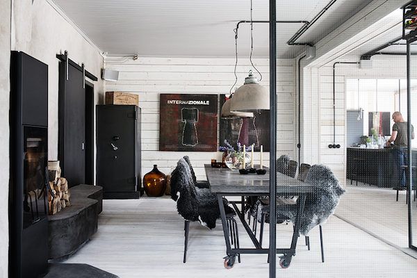 Cool industrial meets cosy rustic in a Swedish home conversion .