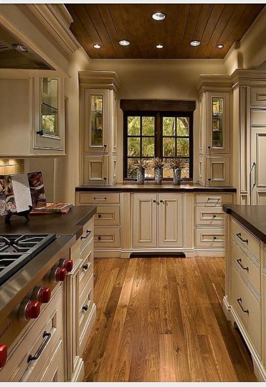 Elegant but homey kitchen with vanilla bean colored cabinets mixed .