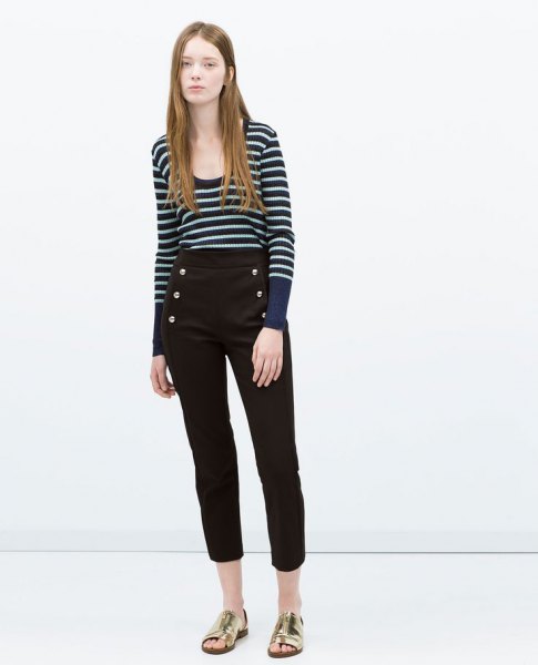dark blue and white striped sweater with scoop neckline and black, shortened trousers