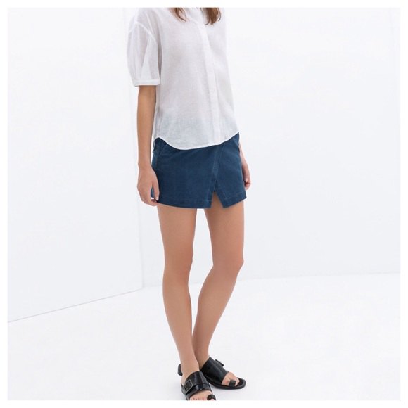 white shirt with relaxed fit and dark blue skort
