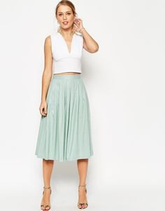 white sleeveless crop top with deep V-neck and gray linen skirt