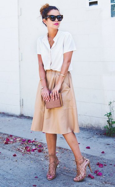 white shirt with buttons and light pink flared midi skirt