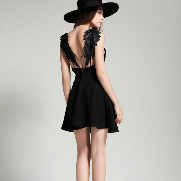 Backless black skater dress with angel wing design