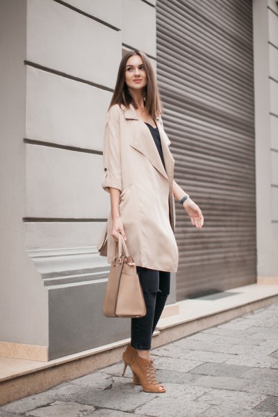 beige long trench coat with half sleeves and black vest