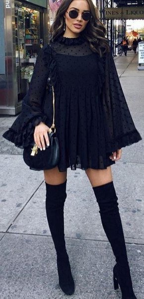 Mini shift dress with bell sleeves and mock neck and black leather bag
