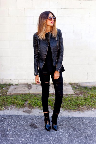 Biker leather jacket with ripped black skinny jeans and leather boots
