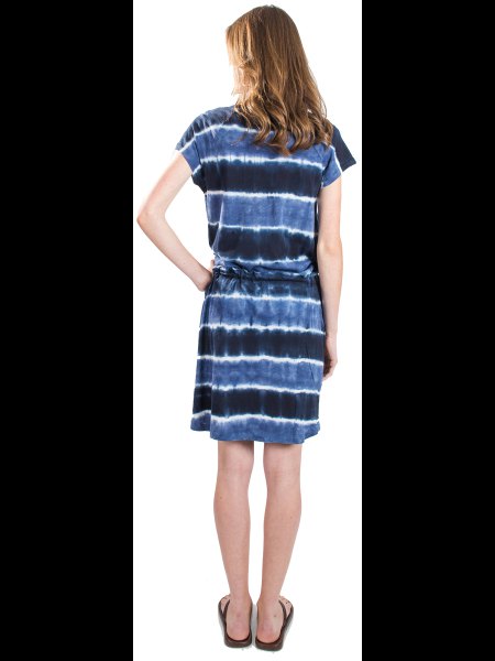 black and blue tie-dye dress with a ruched waist and slip sandals