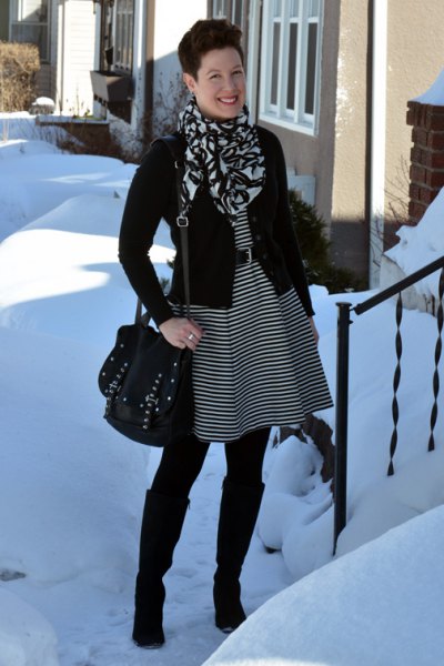 black and gray striped tunic dress with belt and knee-high boots