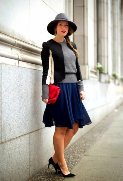 black and white tailored blazer with dark blue skater dress and felt hat