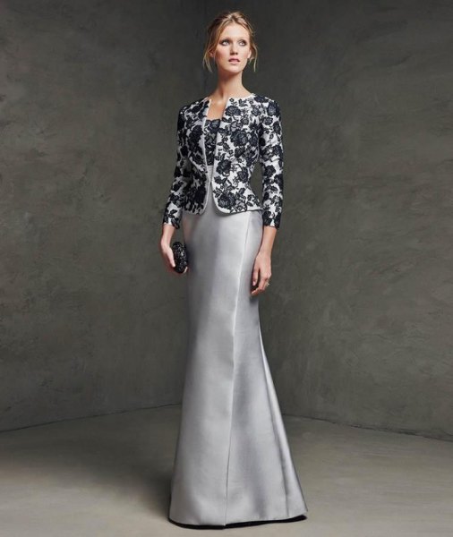 Evening wear made of black and white floral lace with a silver silk dress