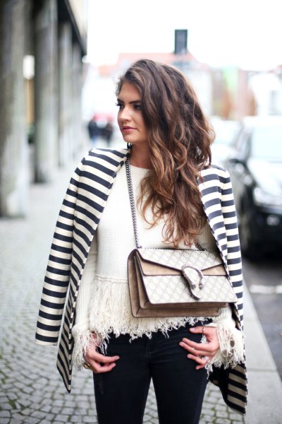 horizontally striped black and white blazer with a fringed sweater