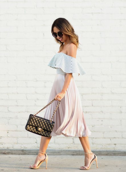 Off-the-shoulder frilled top in black and white with a pleated midi skirt