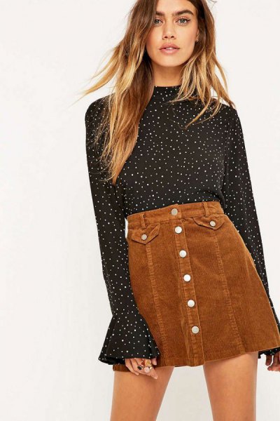 black and white dotted bell sleeve blouse with a brown mini skirt