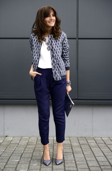 black and white printed blazer with white blouse and shortened navy trousers