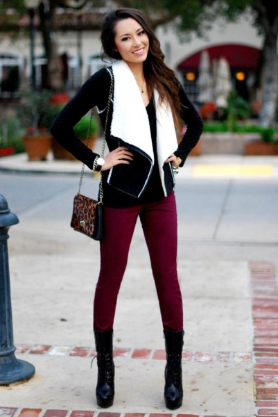 black and white lambskin vest with brown skinny jeans and boots in the middle of the calf