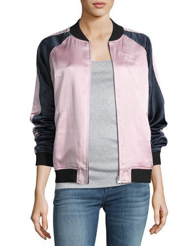black and white silk bomber jacket with gray t-shirt and blue jeans