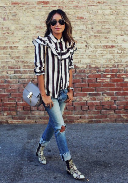 black and white striped shirt with buttons and ripped jeans