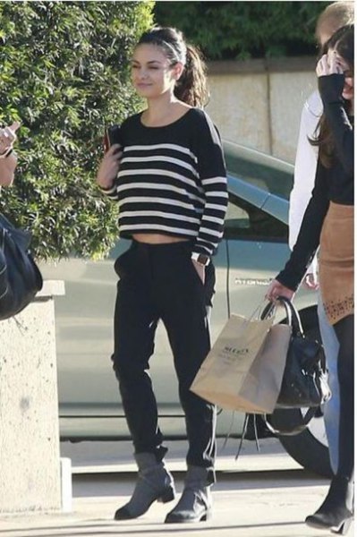 black and white striped shortened sweater with gray boots