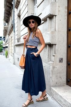 black and white striped, short tank top with dark blue maxi skirt