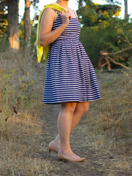 black and white striped fit and flared mini dress with mustard yellow cardigan
