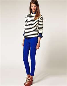 black and white striped knitted sweater with royal blue leggings