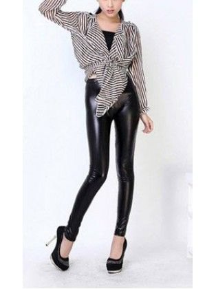 black and white striped knotted blouse with leather gaiters and high heels