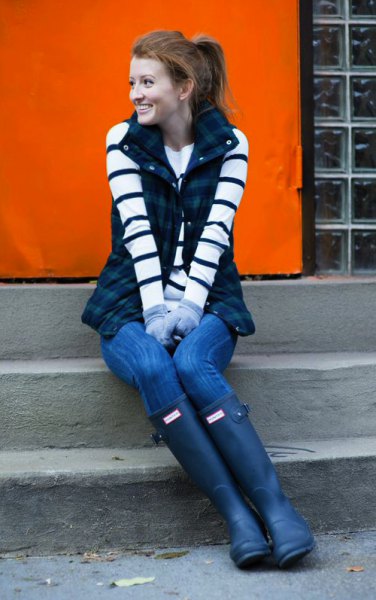 black-and-white striped long-sleeved sweater with dark blue checked vest