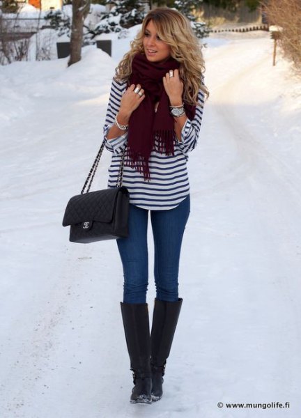 black and white striped long sleeve t-shirt with blue jeans and snowshoes
