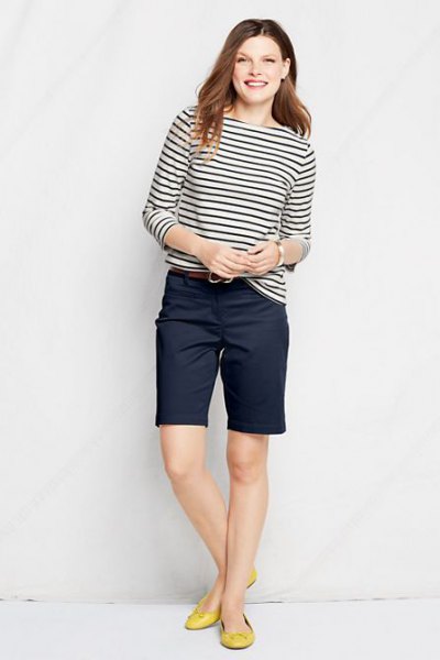 black and white striped long-sleeved T-shirt with knee-length chino shorts in navy blue