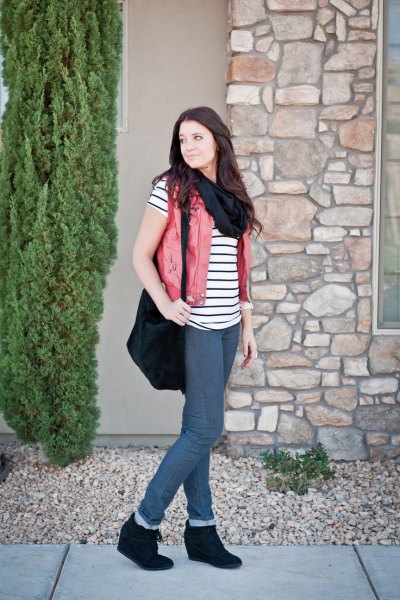 black-and-white striped short-sleeved T-shirt with beige vest and wedge boots